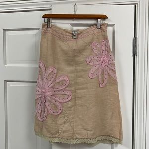 A boutique skirt. Size 0. A line, knee high with intricate detail. Very unique!